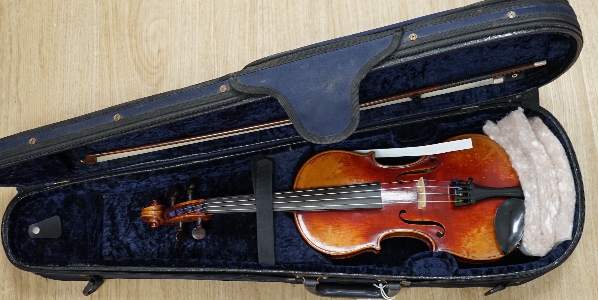 A cased fine French half size violin, Mirecourt, length of body 31.5cm with a bow and case, CITES Submission reference SLU5G6CY